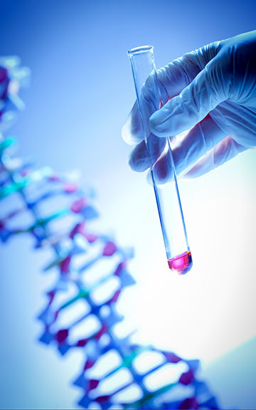 A gloved hand holding a test tube with some red liquid in it. DNA helix is showing in the background.